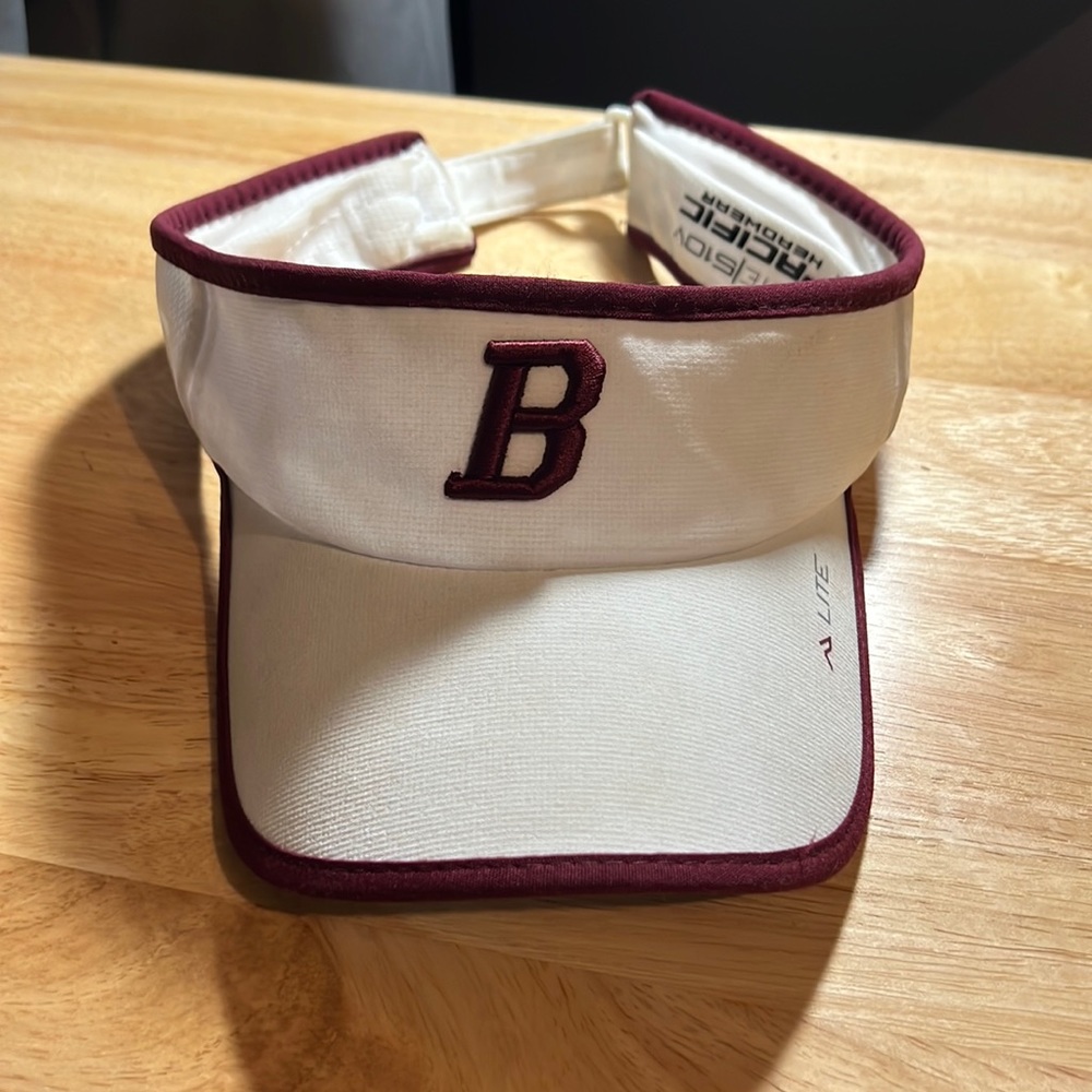 Maroon and white B adjustable strapped visor, never worn.